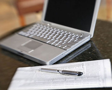 Newspaper and Laptop